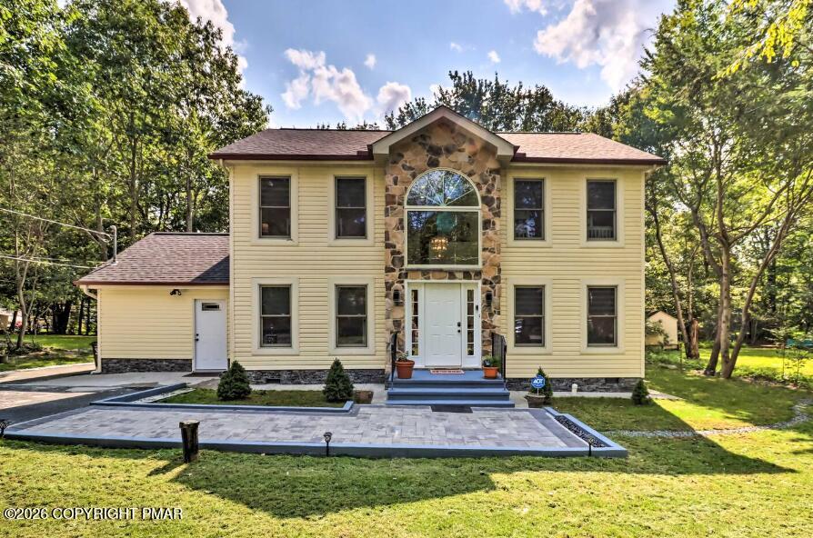 415 Alter Avenue, Unit 415 Pocono Summit, PA 18346 - Photo 1 of 21 a front view of a house with a yard