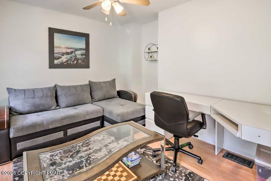 415 Alter Avenue, Unit 415 Pocono Summit, PA 18346 - Photo 15 of 21 a living room with furniture and a rug