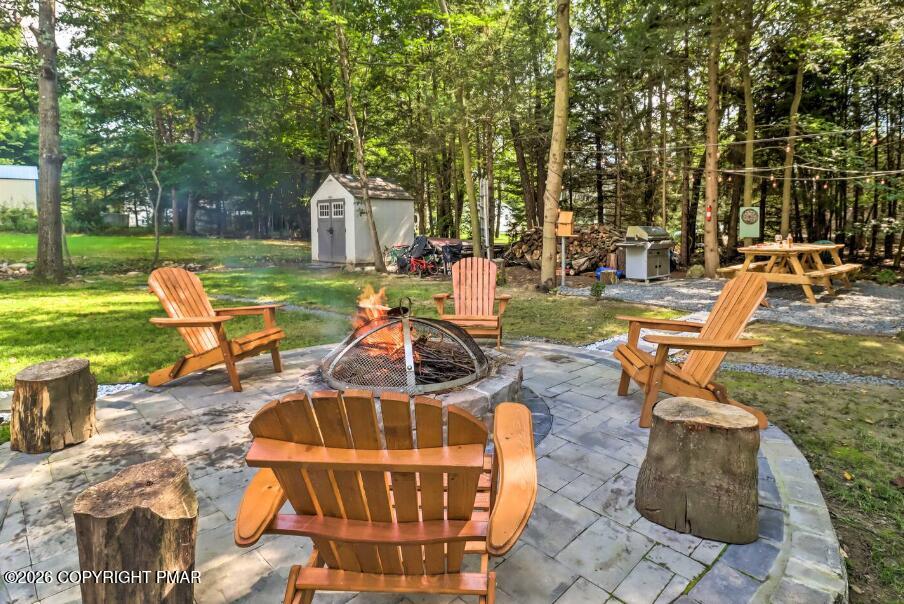 415 Alter Avenue, Unit 415 Pocono Summit, PA 18346 - Photo 20 of 21 a view of a backyard with sitting area