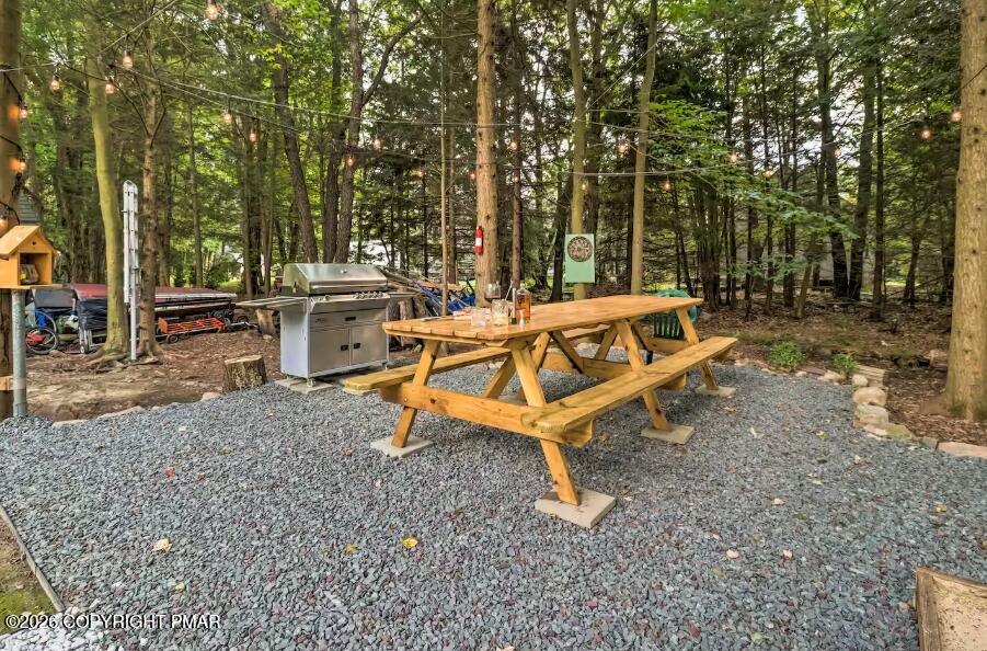 415 Alter Avenue, Unit 415 Pocono Summit, PA 18346 - Photo 21 of 21 a white bench sitting in the middle of a backyard