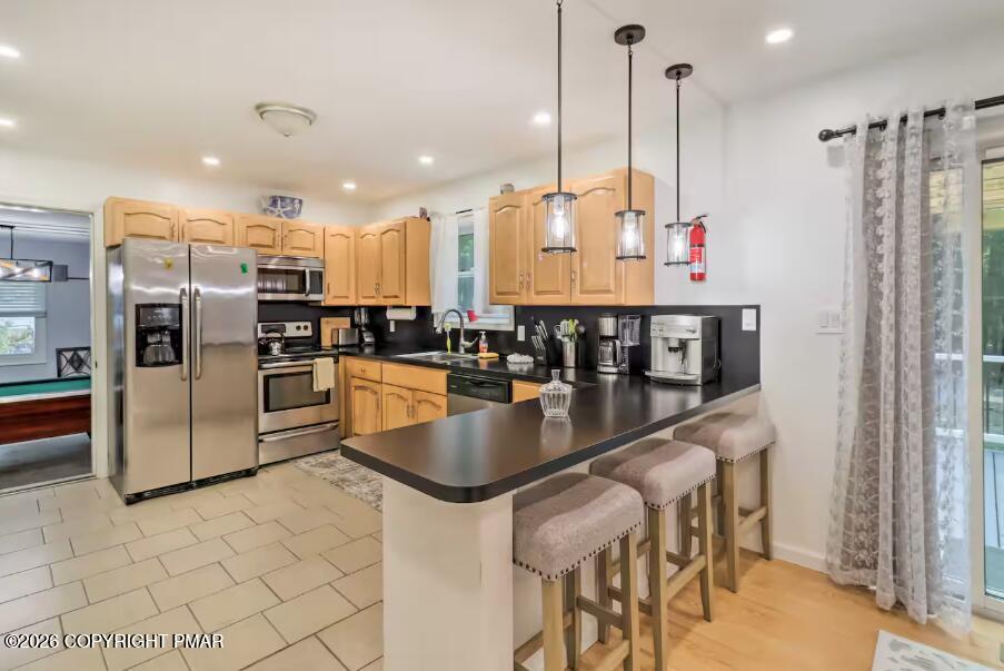 415 Alter Avenue, Unit 415 Pocono Summit, PA 18346 - Photo 7 of 21 a kitchen with stainless steel appliances granite countertop a refrigerator a stove and a sink