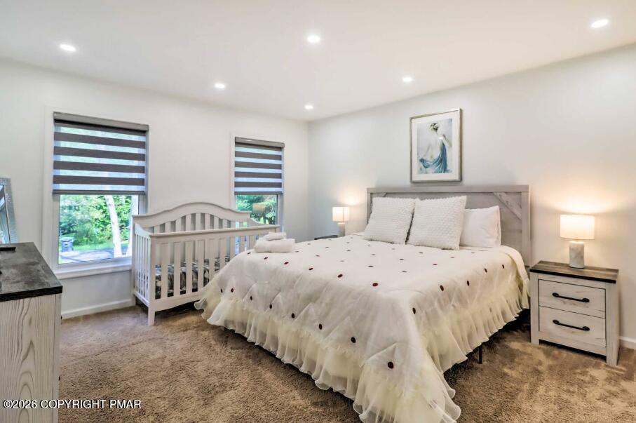 415 Alter Avenue, Unit 415 Pocono Summit, PA 18346 - Photo 8 of 21 a bedroom with a bed and a window