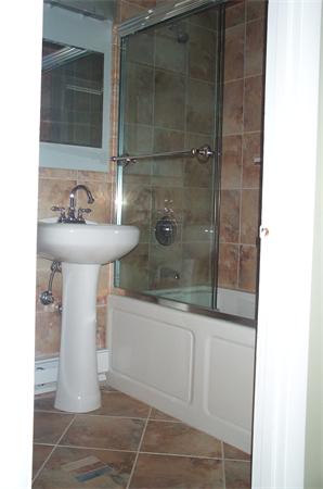 880 Broadway Chelsea, MA 02150 - Photo 11 of 18 a bathroom with a sink a toilet and shower