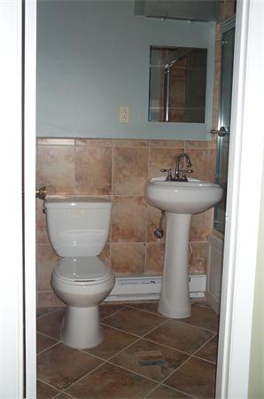 880 Broadway Chelsea, MA 02150 - Photo 10 of 18 a bathroom with a sink toilet and mirror