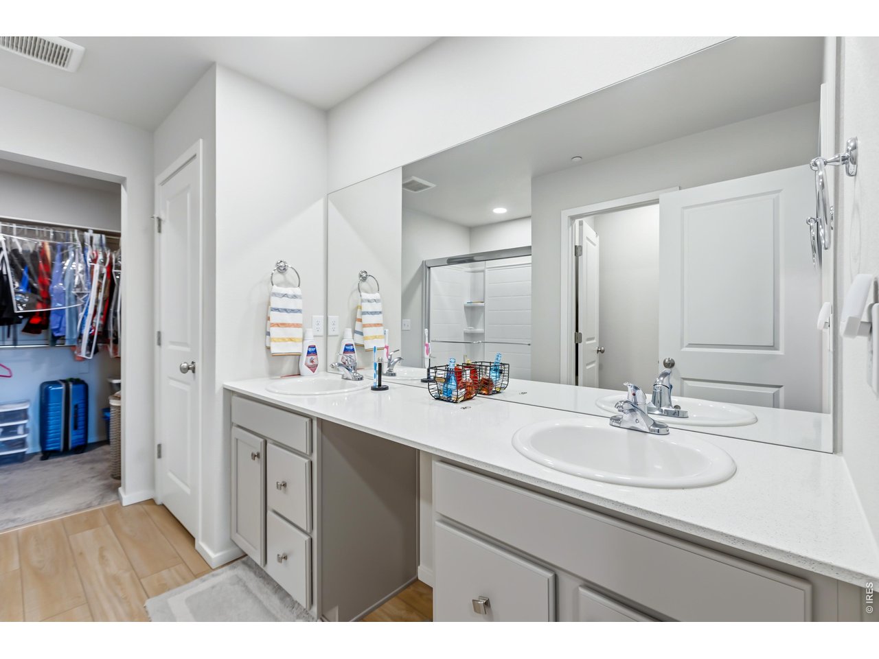 6609 4th St Road, Unit 4 Greeley, CO 80634 - Photo 23 of 41 a bathroom with a sink double vanity and a mirror