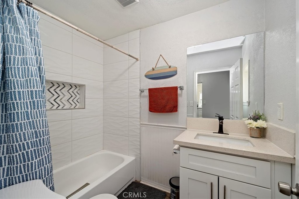 4171 9th Street Riverside, CA 92501 - Photo 15 of 19 a bathroom with a sink toilet and shower