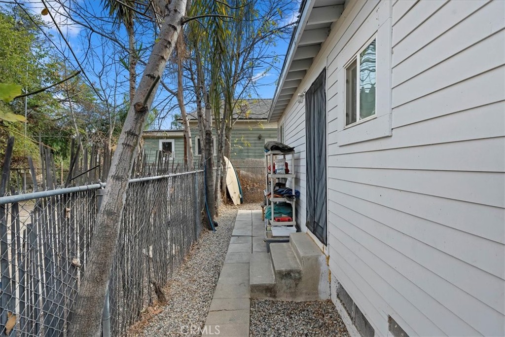 4171 9th Street Riverside, CA 92501 - Photo 16 of 19 a path view of a house with wooden fence
