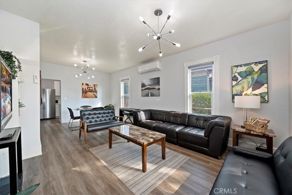 4171 9th Street Riverside, CA 92501 - Photo 6 of 19 a living room with furniture and a wooden floor