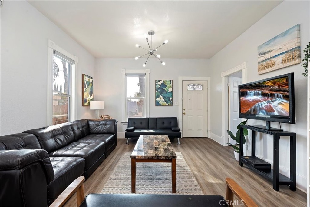 4171 9th Street Riverside, CA 92501 - Photo 7 of 19 a living room with furniture and a flat screen tv