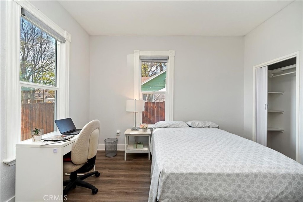 4171 9th Street Riverside, CA 92501 - Photo 8 of 19 a bedroom with a bed and a desk