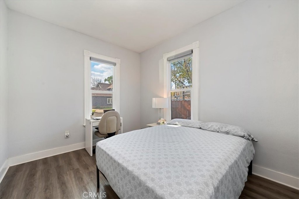 4171 9th Street Riverside, CA 92501 - Photo 9 of 19 a bed sitting in a bedroom next to a window