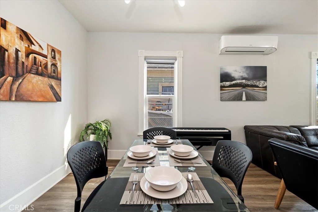 4171 9th Street Riverside, CA 92501 - Photo 10 of 19 a dining room with furniture and wooden floor