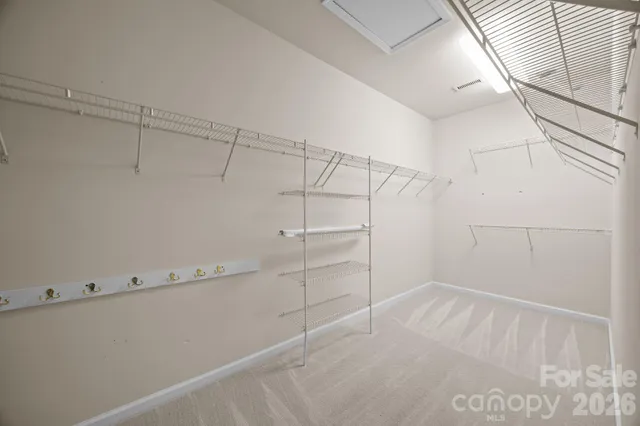 a view of an empty walk in closet