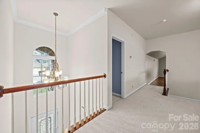 a view of a hallway with windows