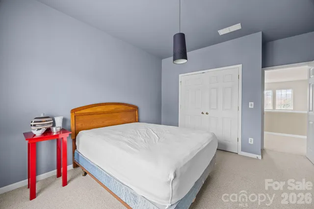 a bedroom with a bed and utility room