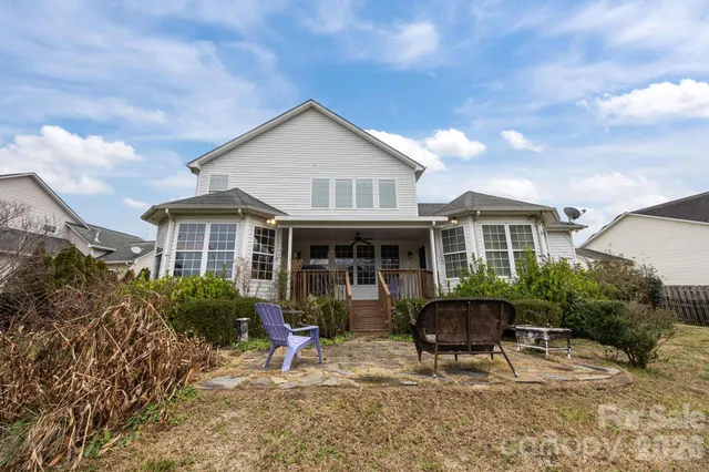 a front view of house with yard and seating