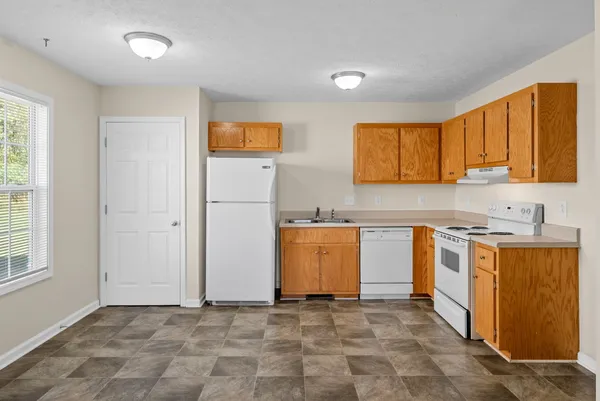 a view of a kitchen with a sink cabinets and a window