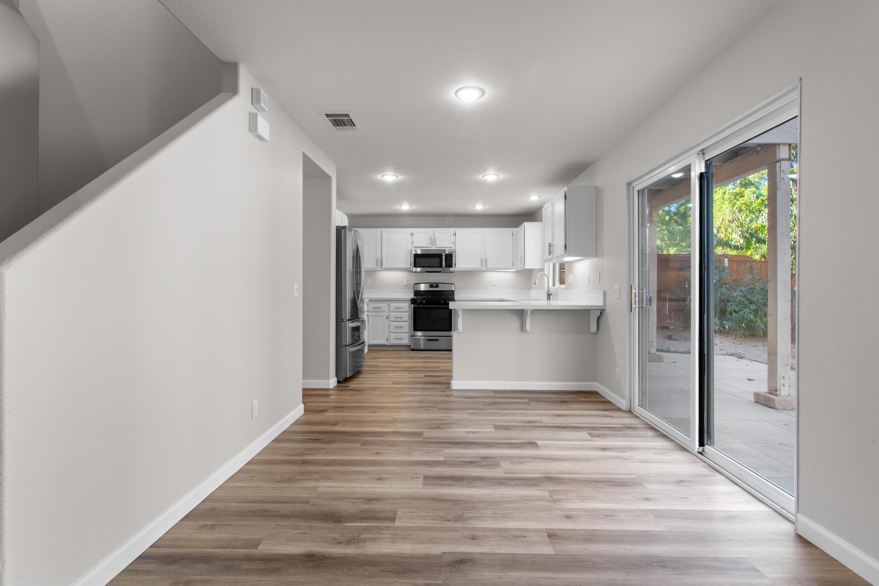 41970 Pacific Grove Way Temecula, CA 92591 - Photo 12 of 54 a view of kitchen with wooden floor
