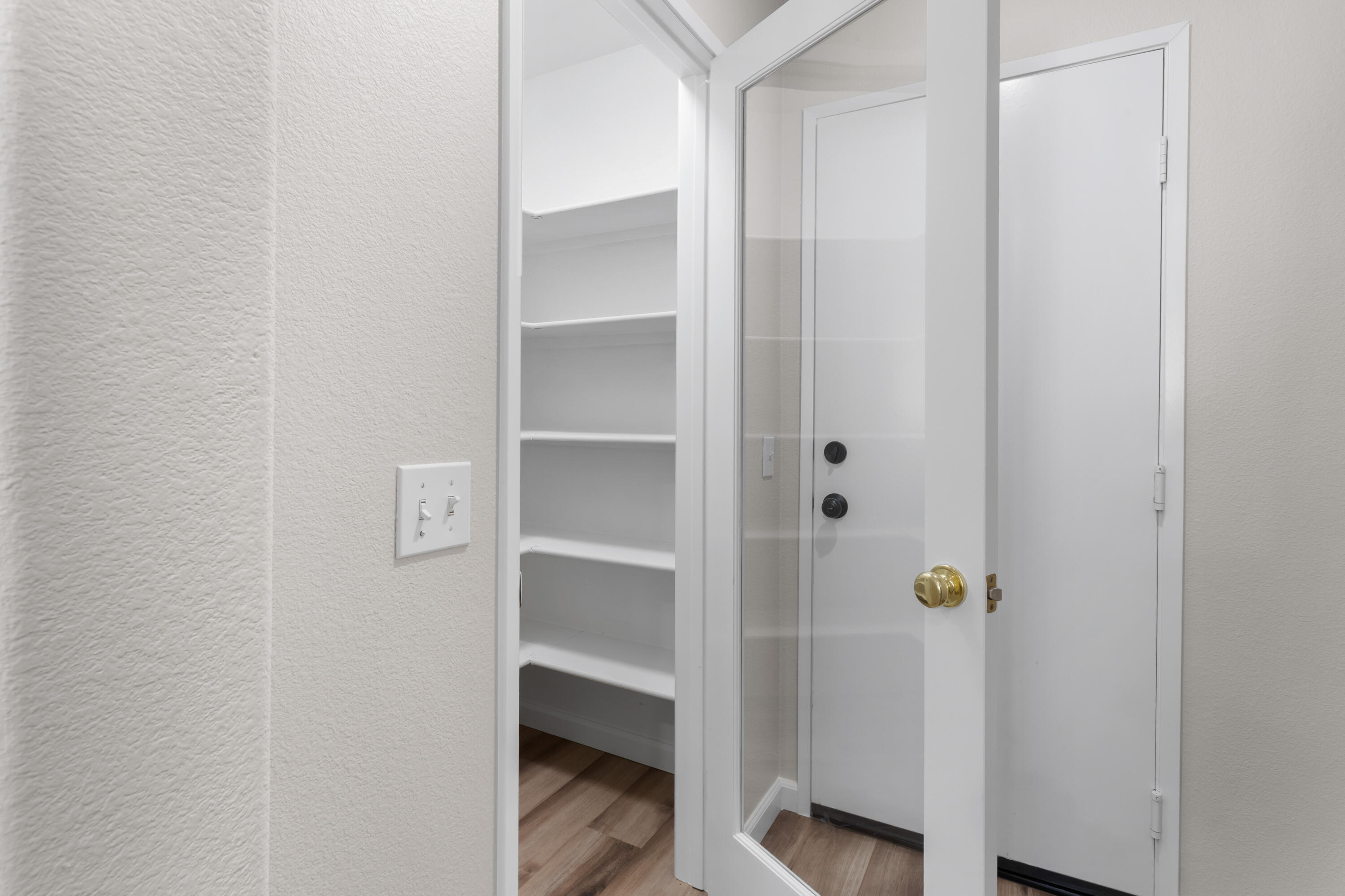 41970 Pacific Grove Way Temecula, CA 92591 - Photo 17 of 54 a view of an entryway with wooden floor