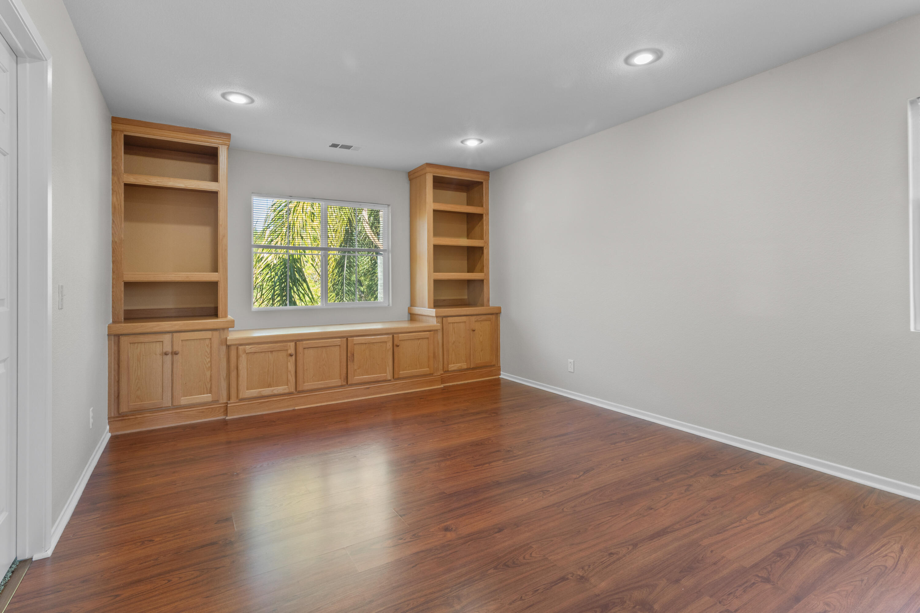 41970 Pacific Grove Way Temecula, CA 92591 - Photo 23 of 54 wooden floor in an empty room with a window