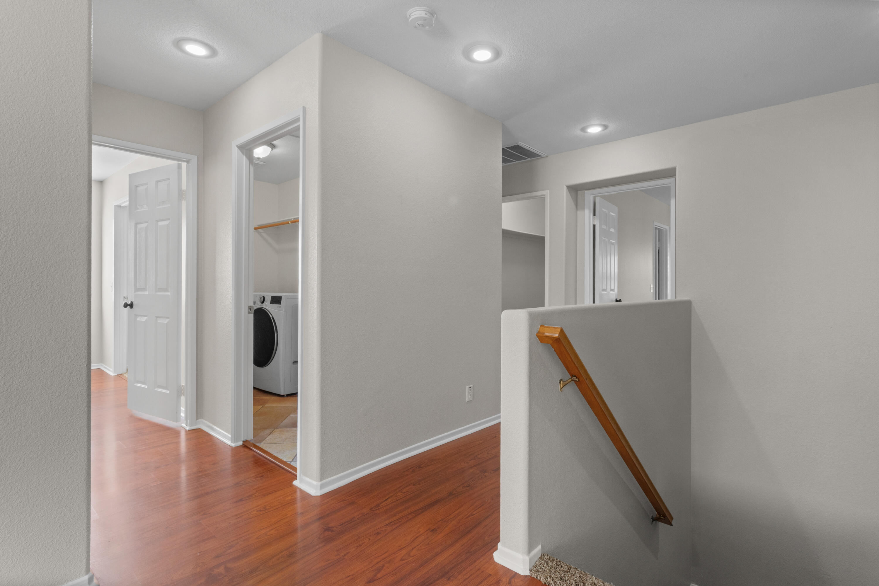 41970 Pacific Grove Way Temecula, CA 92591 - Photo 24 of 54 a view of a hallway with wooden floor and staircase