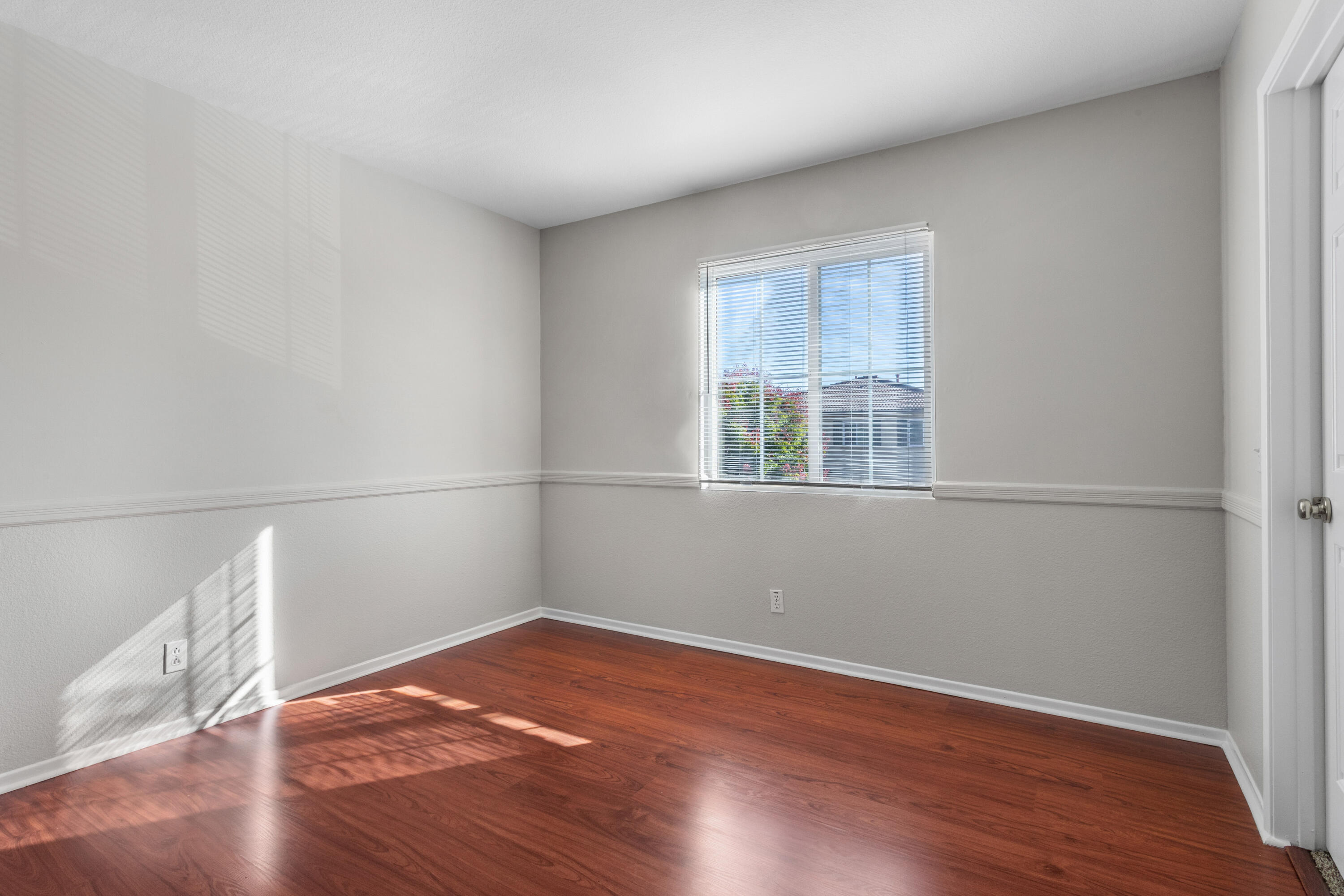 41970 Pacific Grove Way Temecula, CA 92591 - Photo 35 of 54 a view of empty room with wooden floor and fan