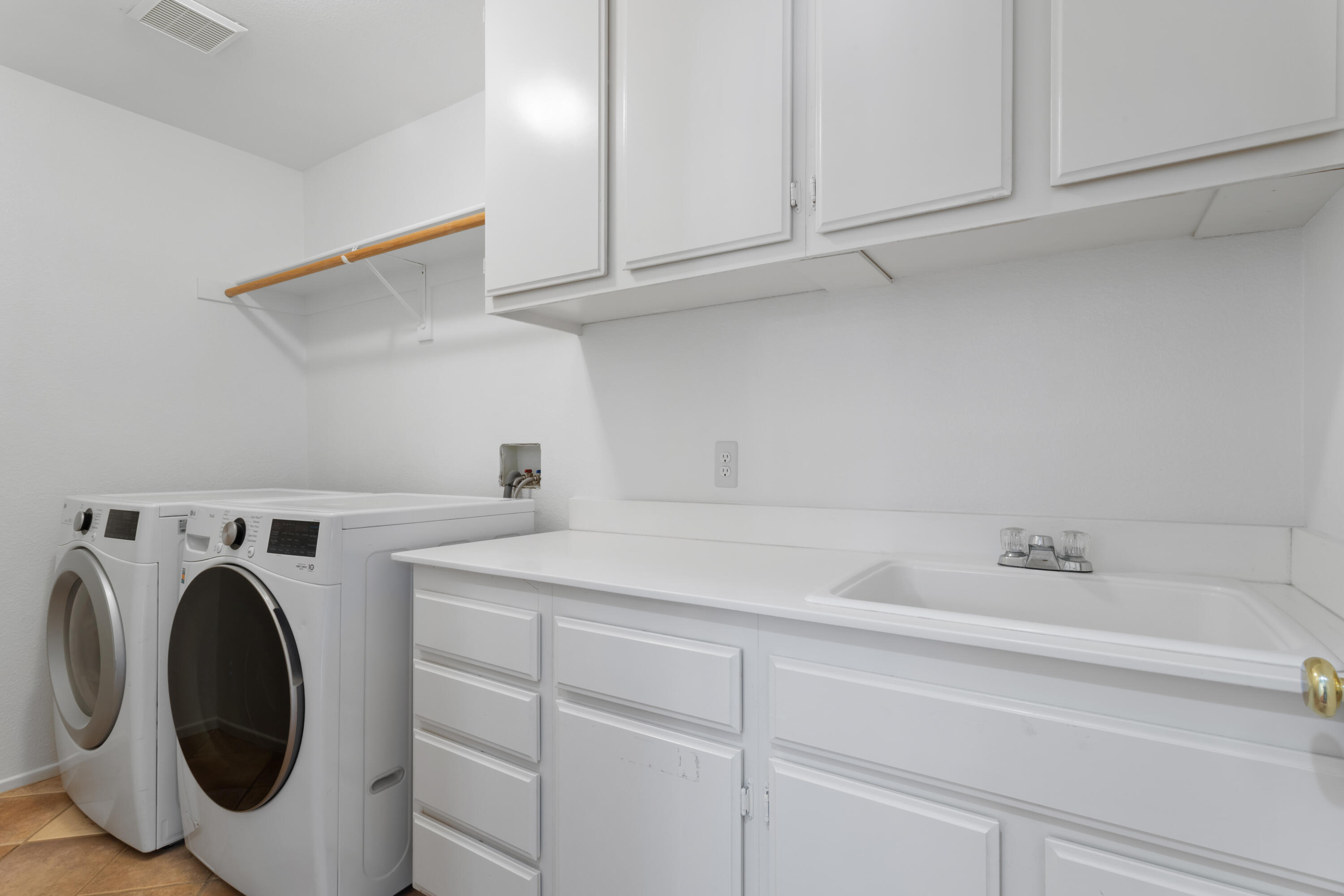 41970 Pacific Grove Way Temecula, CA 92591 - Photo 39 of 54 a utility room with sink dryer and washer