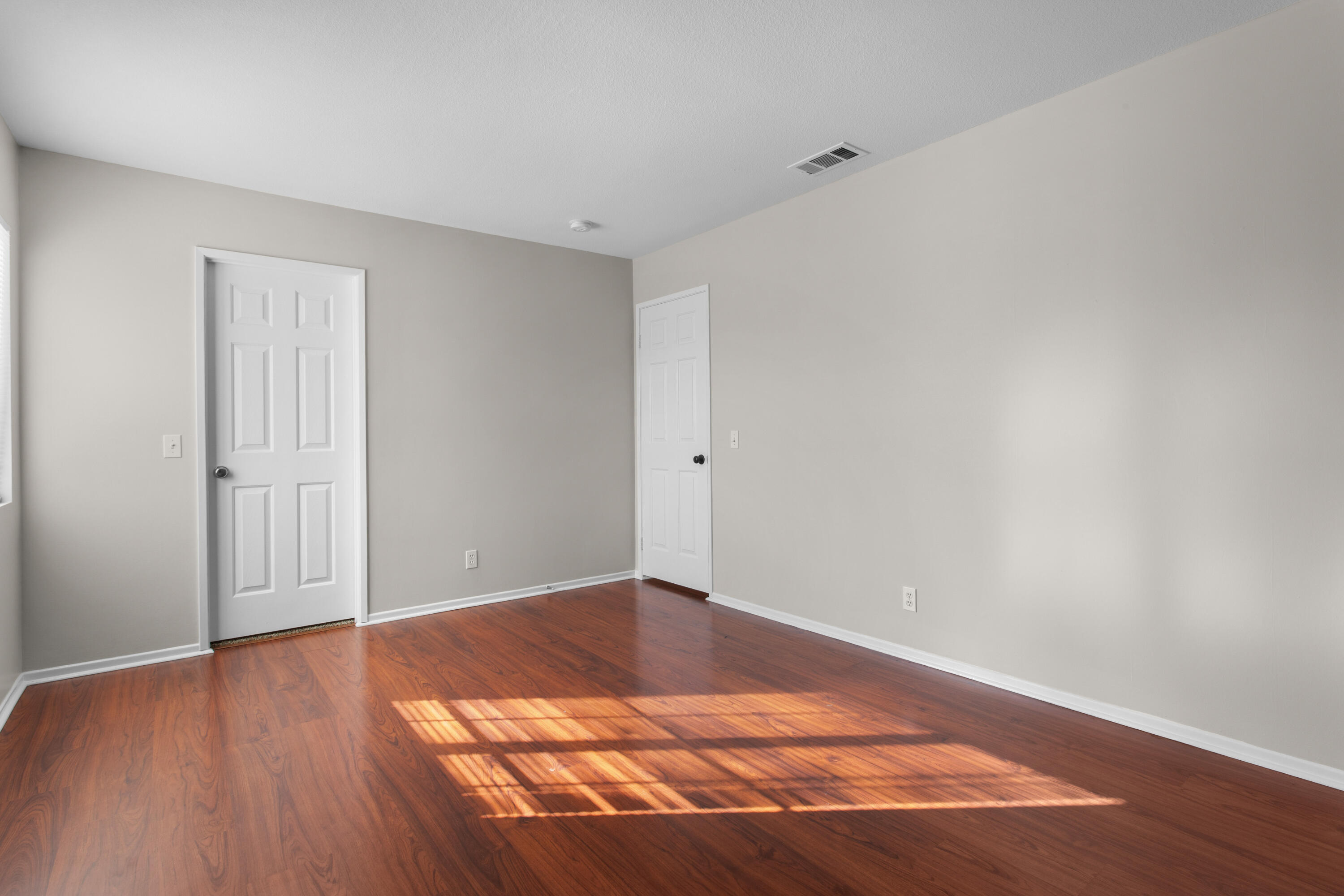 41970 Pacific Grove Way Temecula, CA 92591 - Photo 44 of 54 a view of an empty room with wooden floor