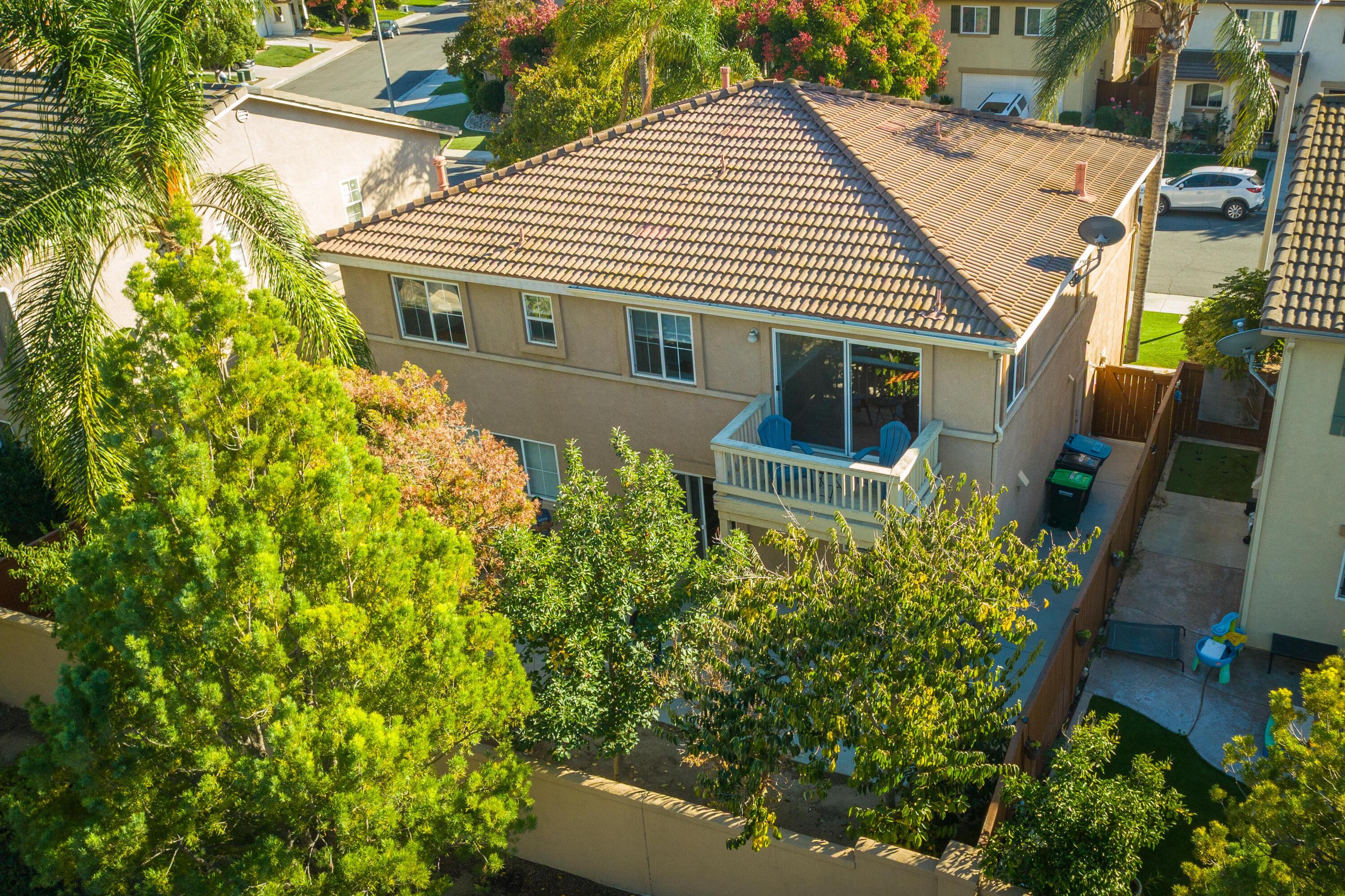 41970 Pacific Grove Way Temecula, CA 92591 - Photo 54 of 54 an aerial view of a house with a yard and potted plants