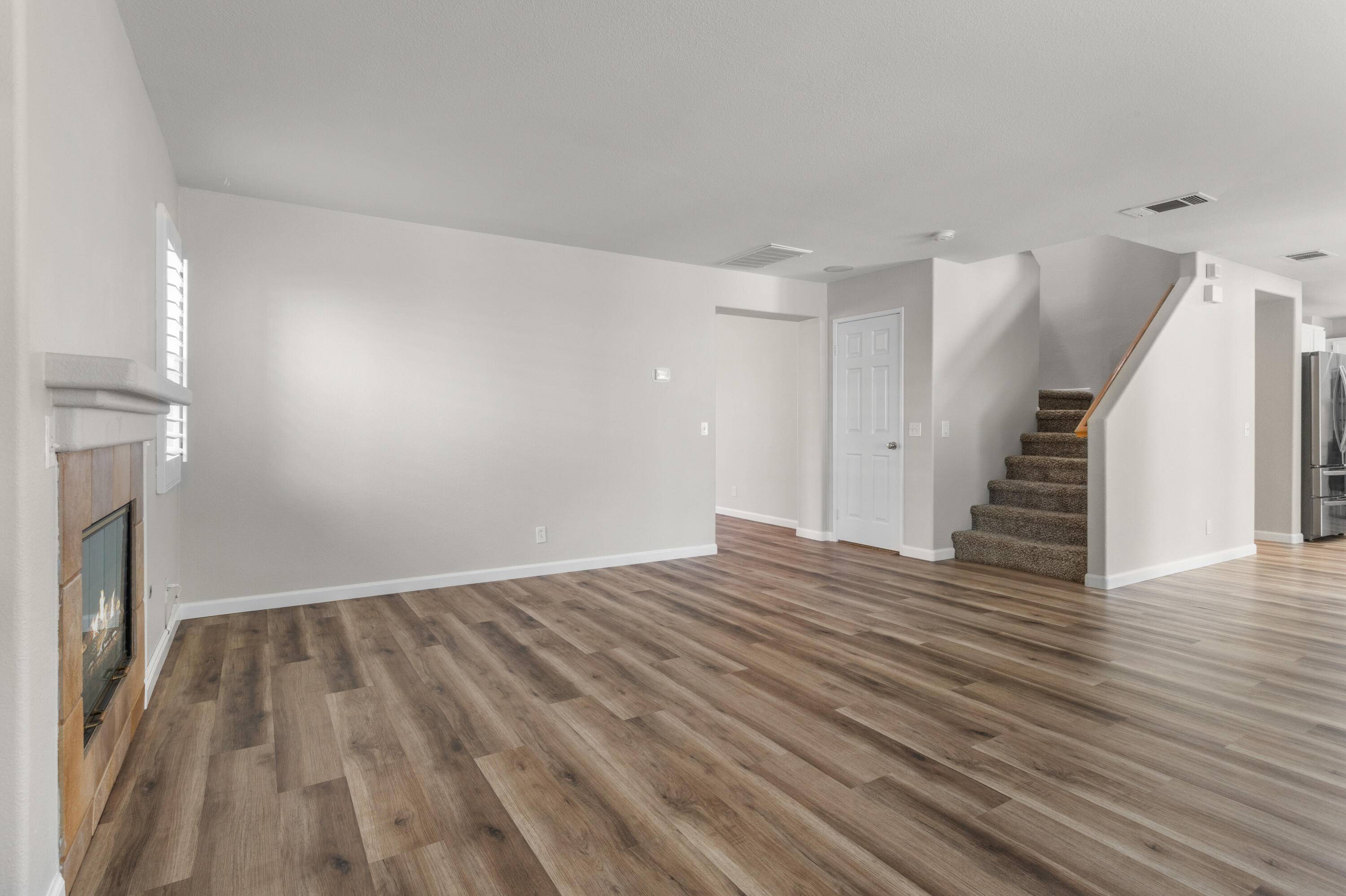 41970 Pacific Grove Way Temecula, CA 92591 - Photo 9 of 54 a view of empty room with wooden floor