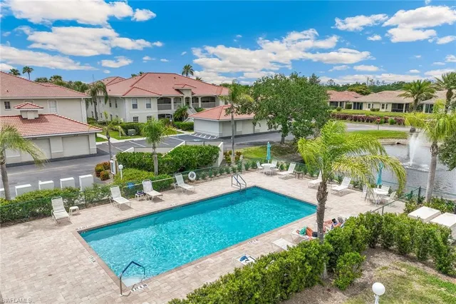 a view of a patio with a table and chairs