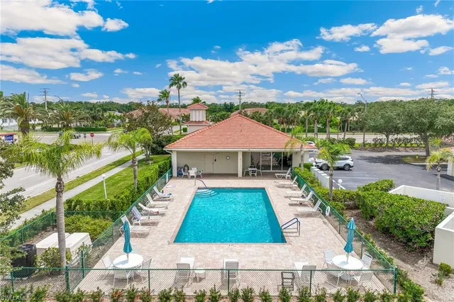 a view of swimming pool in front of yard
