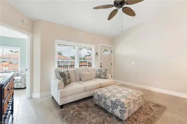 a living room with furniture and a window