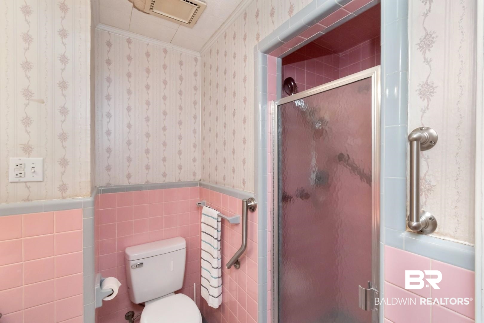6300 Woodcrest Drive Mobile, AL 36608 - Photo 21 of 35 Full bath with tile walls, toilet, wainscoting, wallpapered walls, and a stall shower