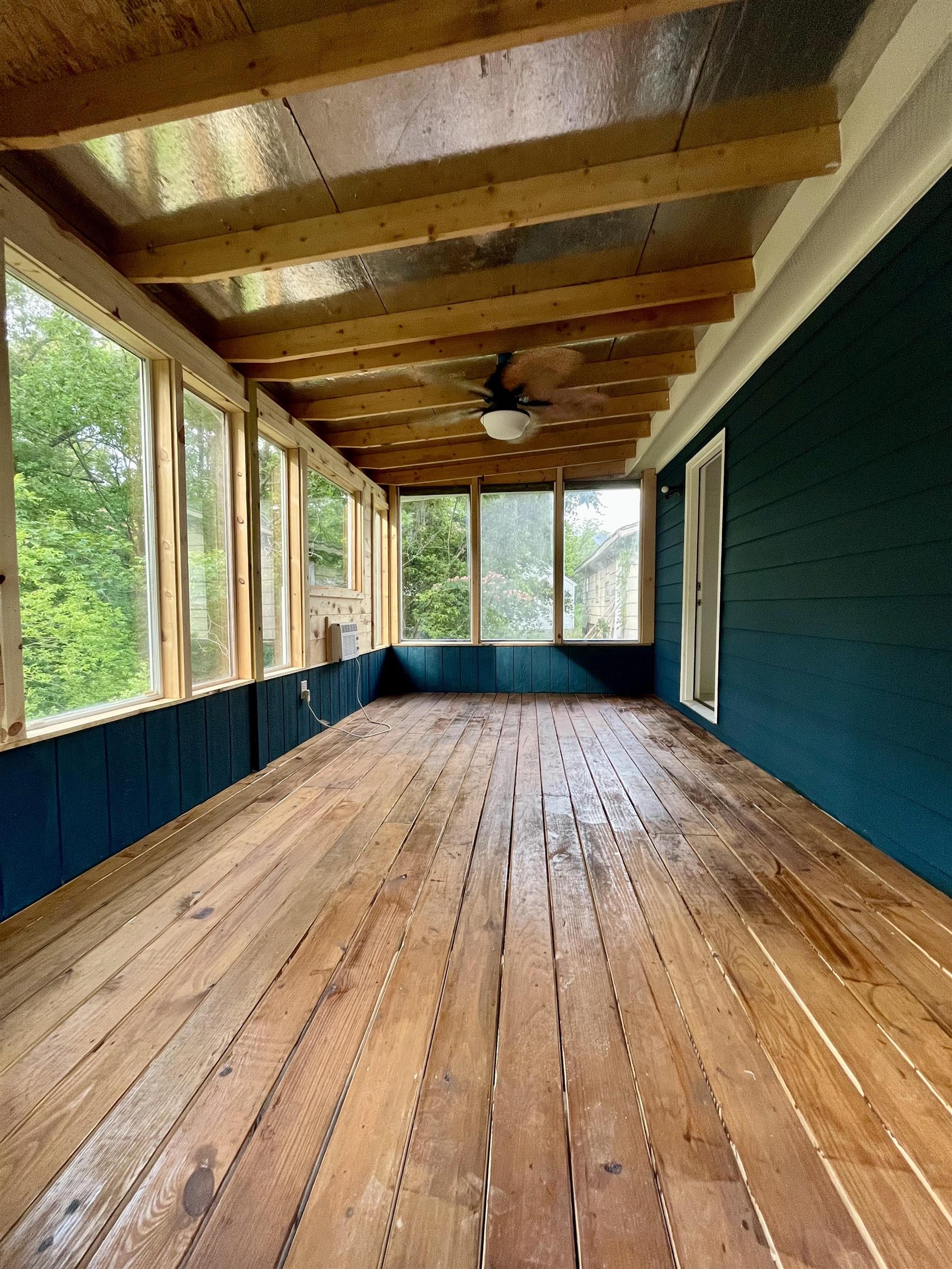 1204 Margaret Road Memphis, TN 38109 - Photo 20 of 25 a view of empty room with wooden floor and fan