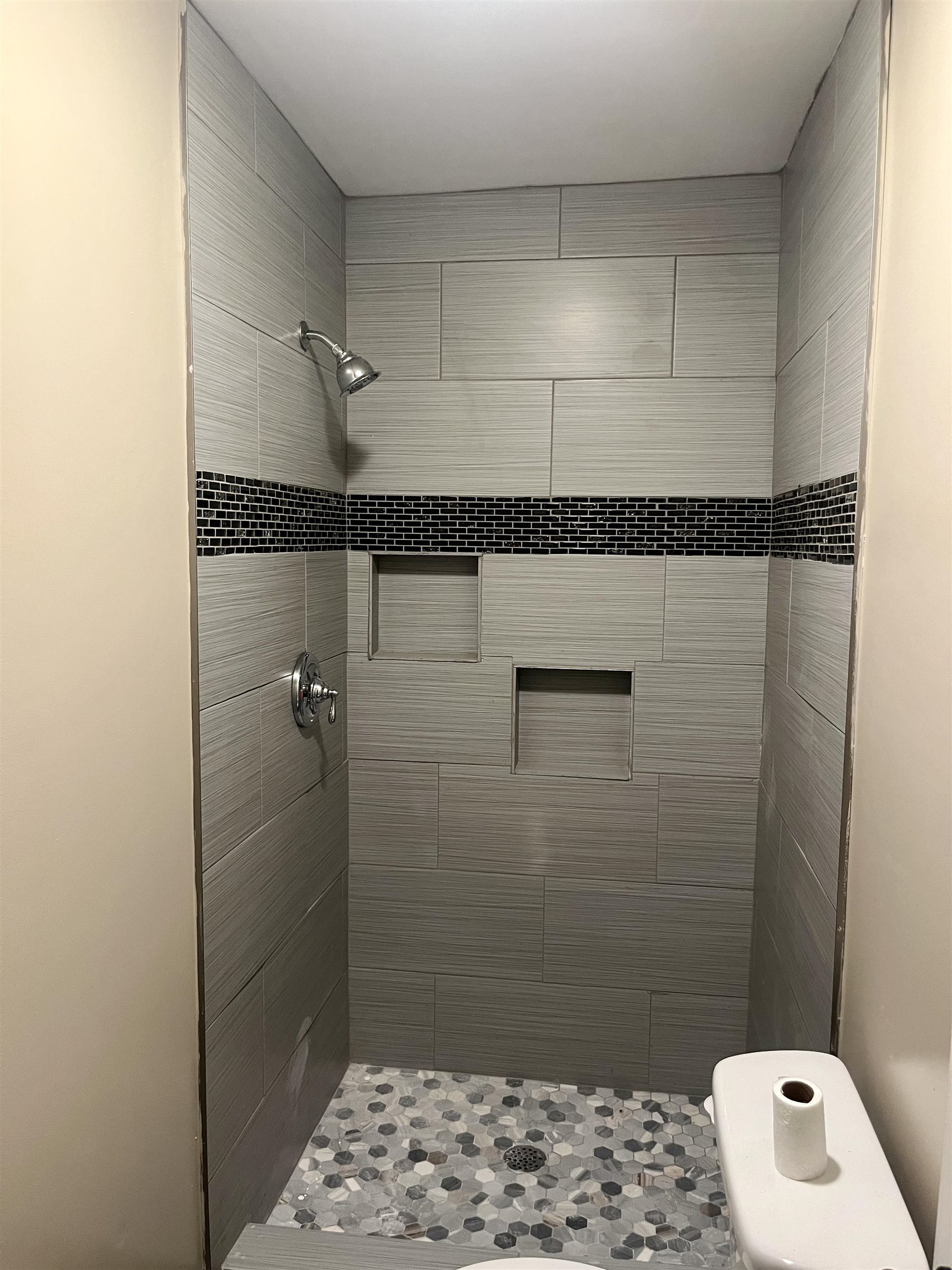 1204 Margaret Road Memphis, TN 38109 - Photo 10 of 25 a bathroom with a shower and a toilet