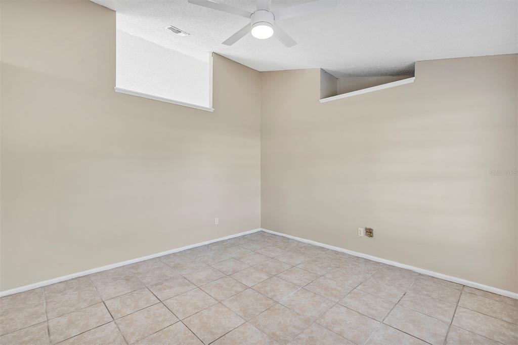 6701 Merlin Court Orlando, FL 32810 - Photo 19 of 54 an empty room with white walls
