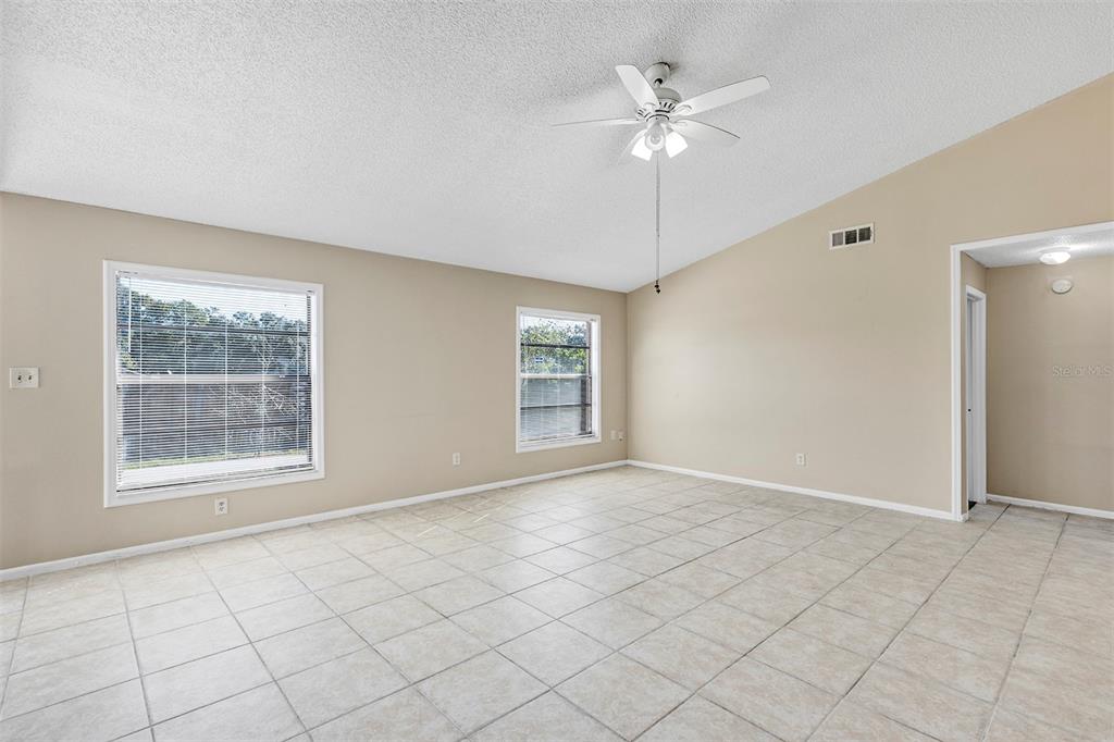 6701 Merlin Court Orlando, FL 32810 - Photo 35 of 54 an empty room with fan and windows