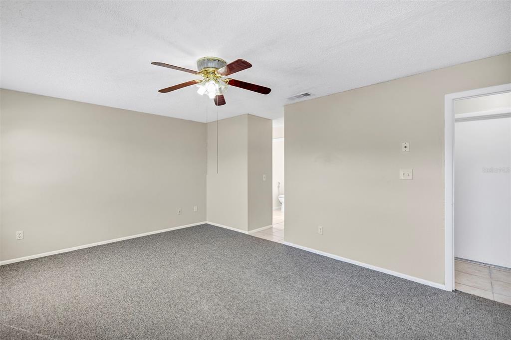 6701 Merlin Court Orlando, FL 32810 - Photo 37 of 54 a view of a big room with carpet