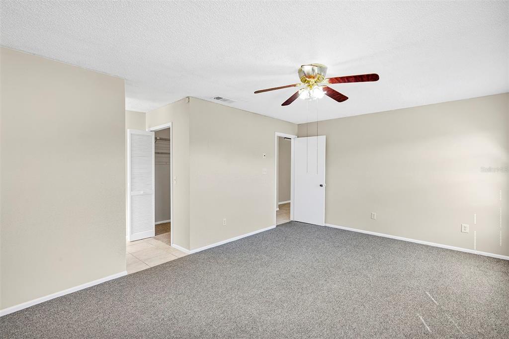 6701 Merlin Court Orlando, FL 32810 - Photo 38 of 54 a view of a ceiling fan in a room