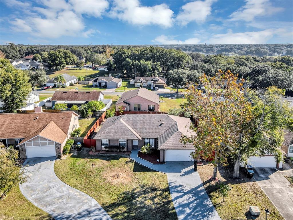 6701 Merlin Court Orlando, FL 32810 - Photo 46 of 54 an aerial view of a house with a garden