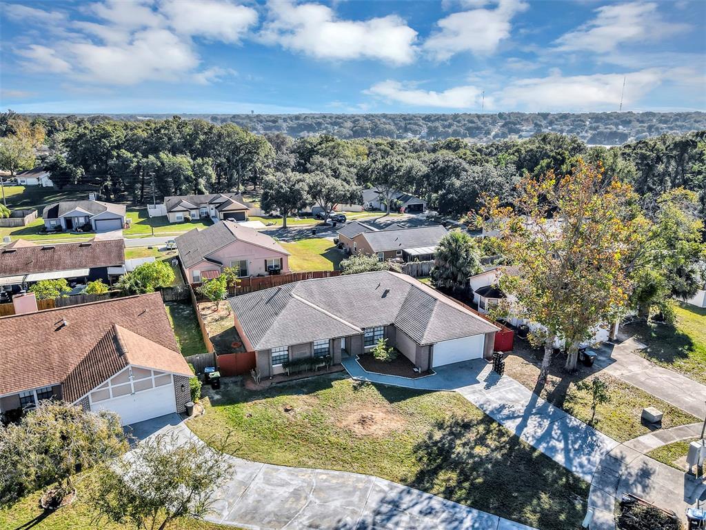 6701 Merlin Court Orlando, FL 32810 - Photo 48 of 54 an aerial view of a house with a garden