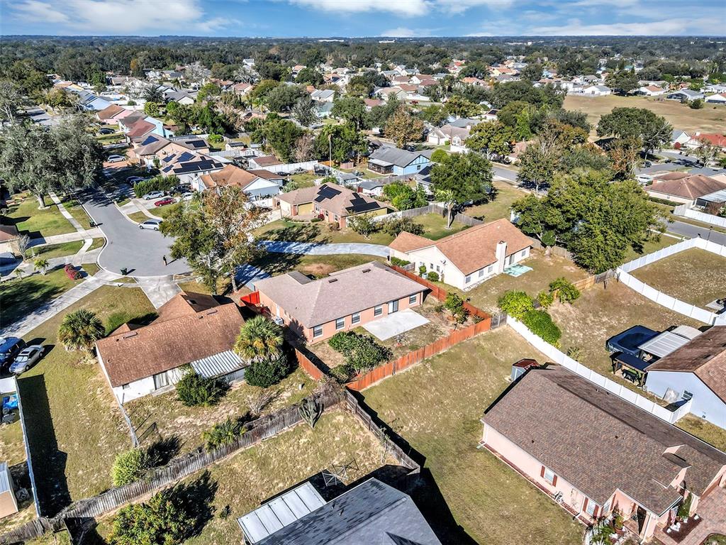 6701 Merlin Court Orlando, FL 32810 - Photo 49 of 54 an aerial view of residential houses with outdoor space