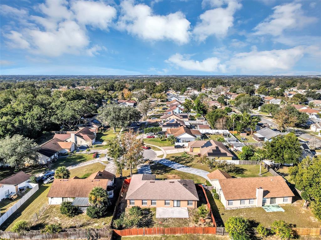 6701 Merlin Court Orlando, FL 32810 - Photo 50 of 54 an aerial view of residential houses with outdoor space