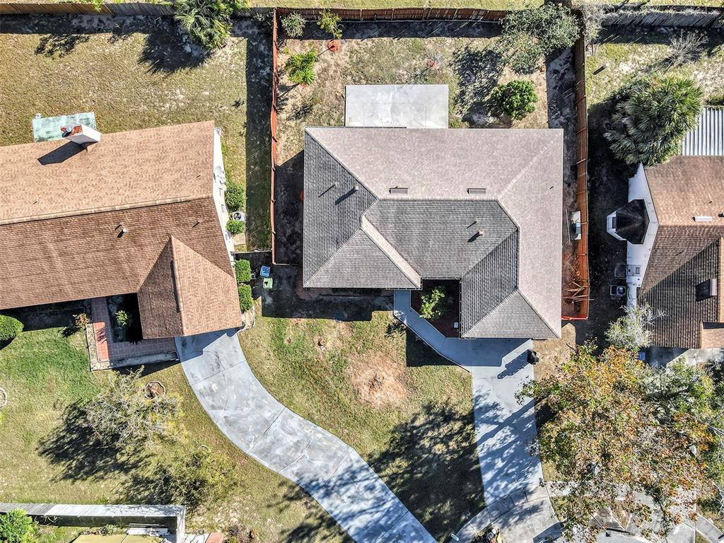 6701 Merlin Court Orlando, FL 32810 - Photo 51 of 54 aerial view of a house with a yard