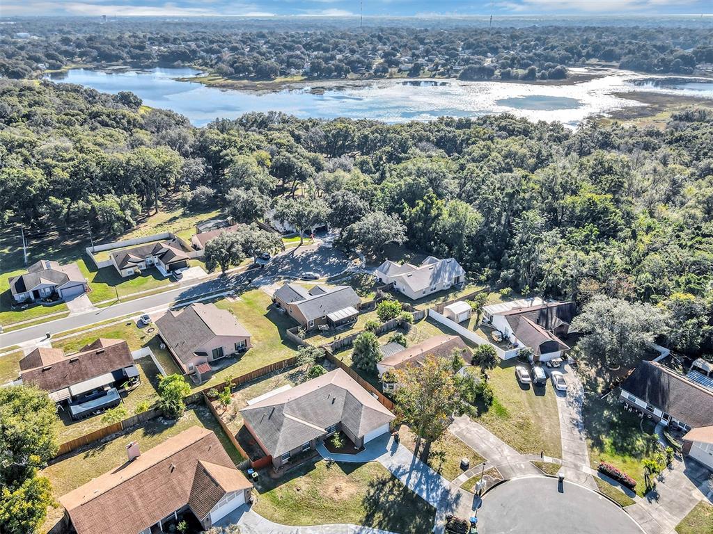 6701 Merlin Court Orlando, FL 32810 - Photo 53 of 54 an aerial view of residential houses with outdoor space