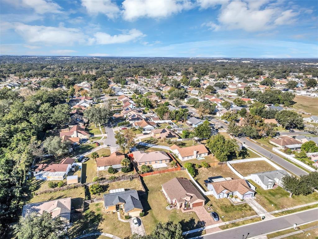 6701 Merlin Court Orlando, FL 32810 - Photo 54 of 54 an aerial view of residential houses with outdoor space