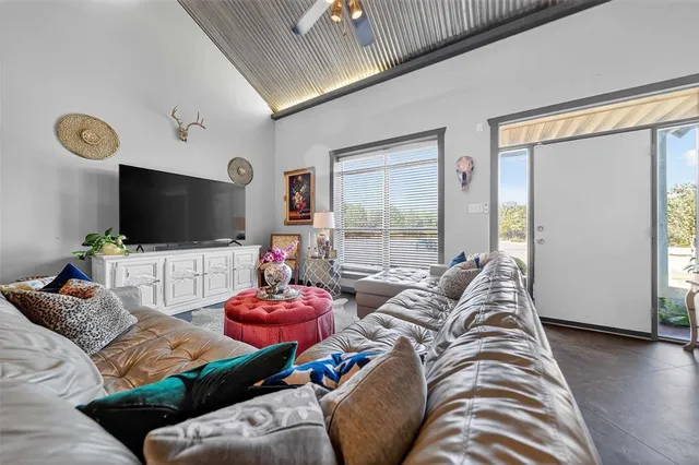 a large kitchen with a lot of counter space and wooden floor