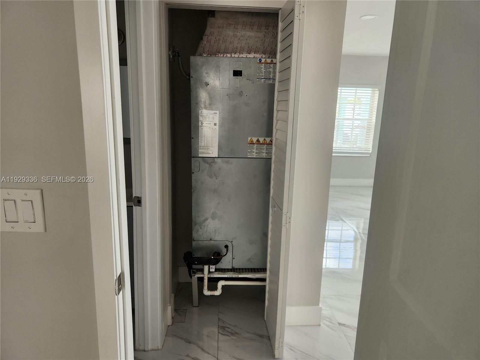 342 East 46th Street, Unit 1 Hialeah, FL 33013 - Photo 13 of 26 a view of a bathroom from a hallway
