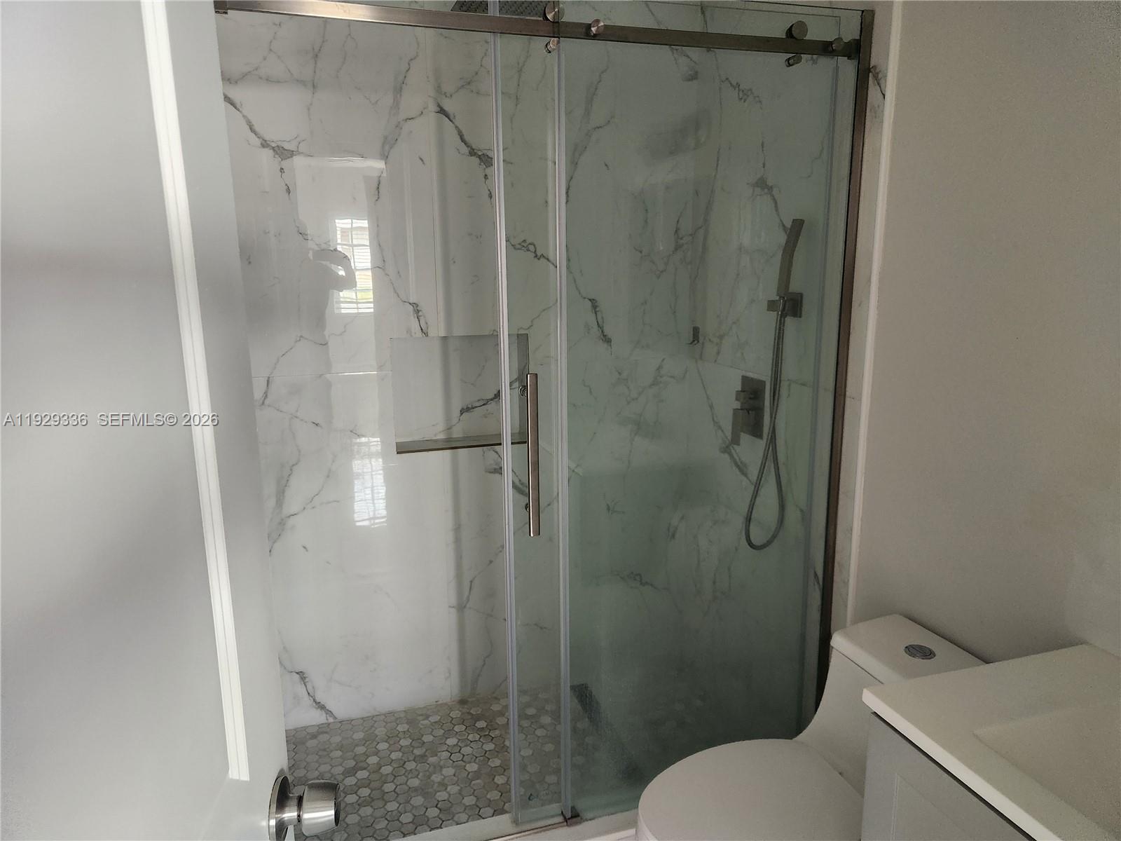 342 East 46th Street, Unit 1 Hialeah, FL 33013 - Photo 15 of 26 a bathroom with a shower and toilet